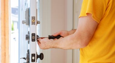 Man changing locks in home