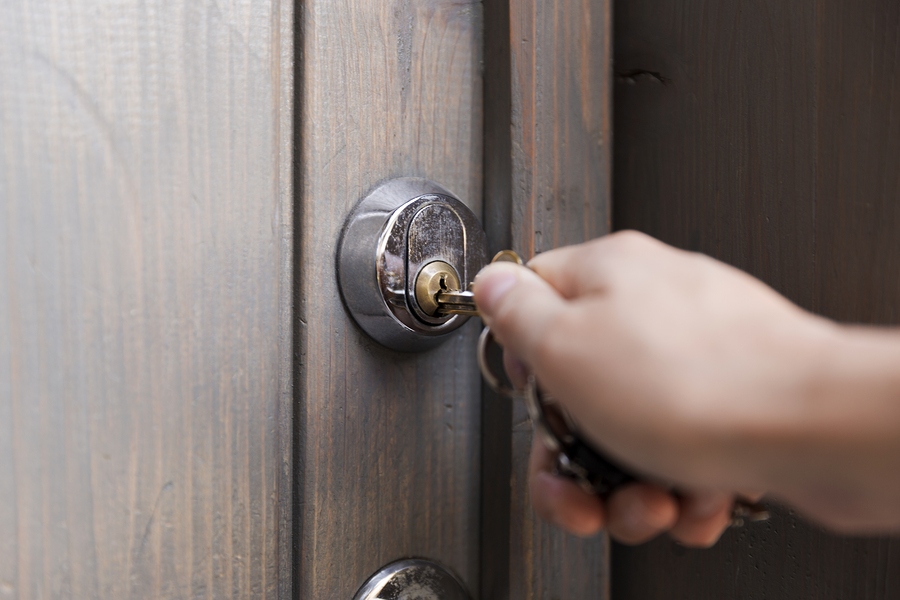 bigstock Woman s Hand Puts The Key In T 251375251