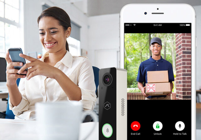 Woman using a video doorbell app showing a delivery person at the door